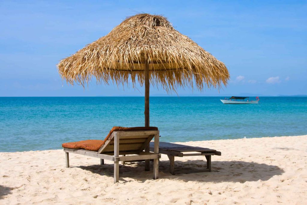Overseas Landlords - Umbrella on beach